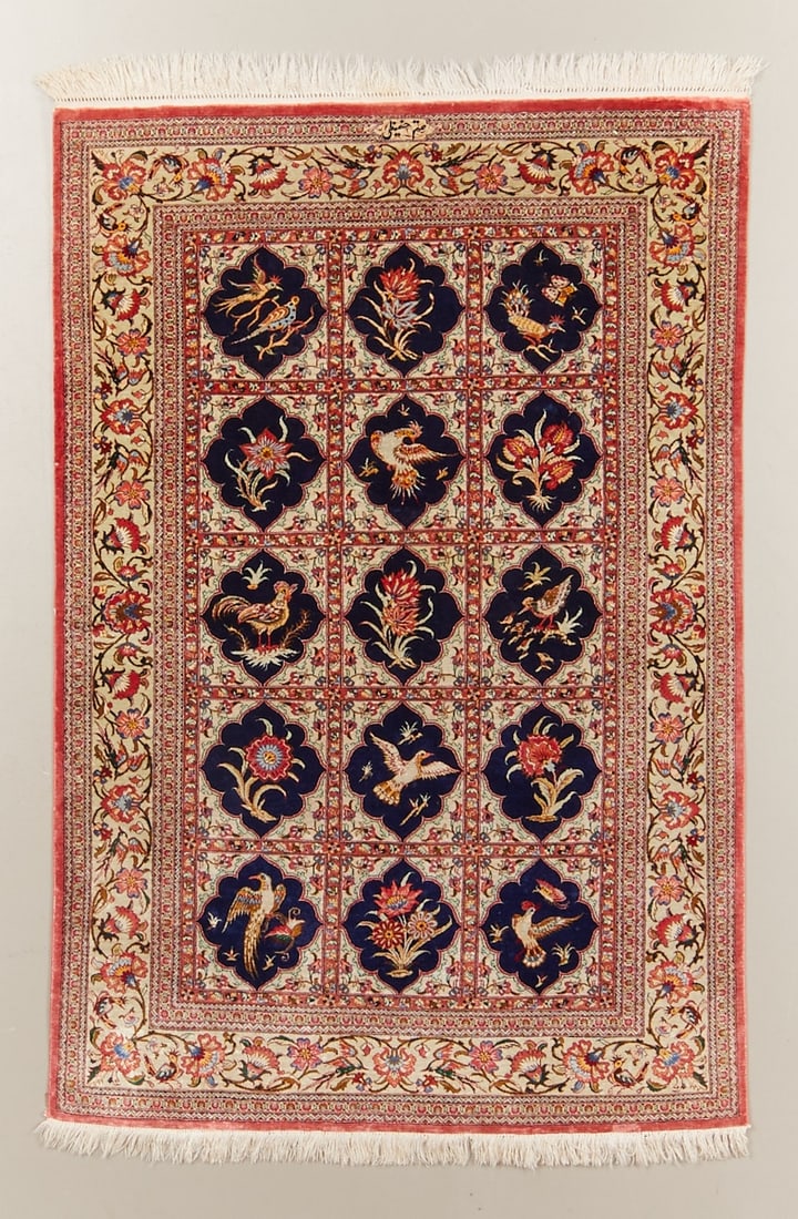 Ghom: Ghom Persia, 20th century. Finely knotted silk oriental rug with rich field decor and floral framing, approx. 162 x 101 cm. On an ivory ground, twelve ornamentally framed picture fields with birds,