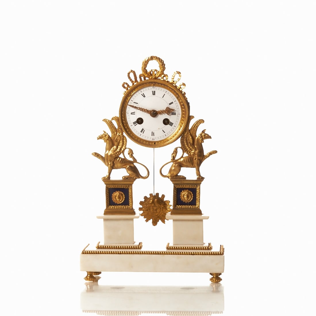 Empire Pendulum Clock: Empire Pendulum Clock Paris/France, circa 1820. Bronze. Enamel. Marble. H. 30.5 cm. Thread suspension. Pendulum. Striking on bell. Arabic and Roman numerals. Marked on the plinth; Clays Ae a Paris.