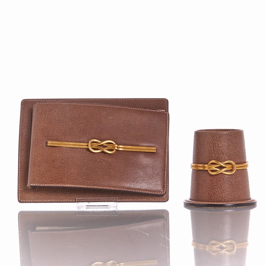 GUCCI - Vintage Memo Pad Holder and Leather Cup: GUCCI - Vintage Memo Pad Holder and Leather Cup Gucci, Italy. Brown grained leather. Gold-colored metal applications in the shape of the characteristic Gucci knot. Memo pad holder with an inserted ori