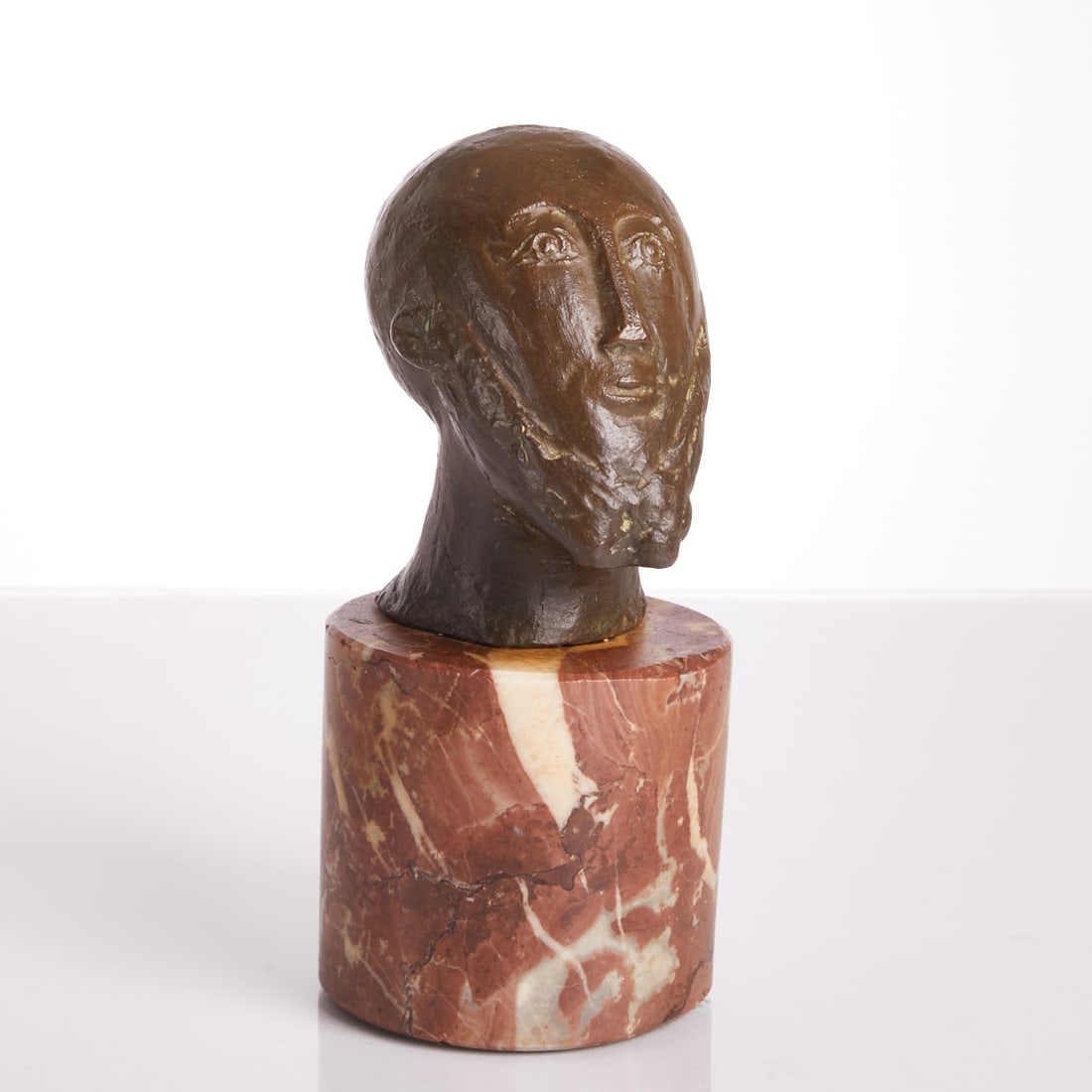 20th Century Artist: 20th Century Artist - Head - Bronze. Brown patina. Marble. H. w./w. base 9/16.5 cm. Monogrammed on the reverse: HLB.