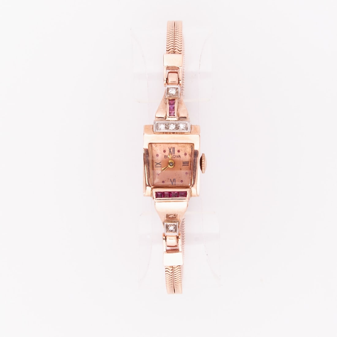 Ladies' wristwatch from the 1920s-1930s: Ladies' wristwatch from the 1920s-1930s Bulova Watch Co. Inc. 585/- rose gold, stamped. Total weight: 22 g. 7 baguette-cut rubies totaling approx. 0.13 ct. 5 diamonds in 8/8 cut totaling approx. 0.10 