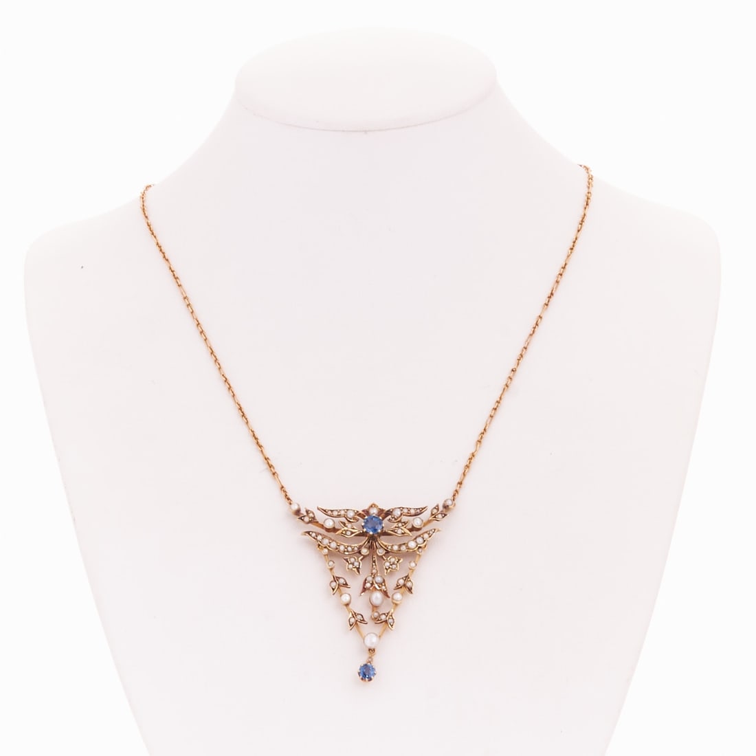 Historicism Necklace with Pearl and Blue Stone Embellishment: Historicism necklace with pearl and blue stone embellishment Circa 1900. 585/- yellow gold, stamped. Weight: 9.3 g. Hallmark: 15 K. no. 10672. Probably 2 round-cut sapphires totaling approx. 0.7 ct. V