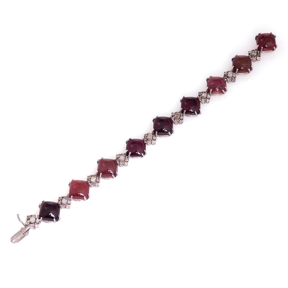 Tourmaline-Diamond Bracelet: Tourmaline-Diamond Bracelet 585/- white gold, stamped. Total weight: 27.7 g. 9 tourmalines of varying intensity in cabochon cut (rose-violet) total approx. 61.50 ct. Various brilliant-cut diamonds