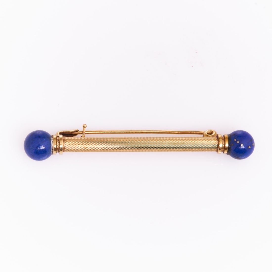 Lapis Lazuli Pin: Lapis Lazuli Pin Mid-Century. 585/- yellow gold, stamped. Total weight: 3.9 g. 2 lapis lazuli spheres. L. 5.3 cm. W. 0.72 cm. Pin with safety slide. Very good condition. Simple Mid-Century pin with tw