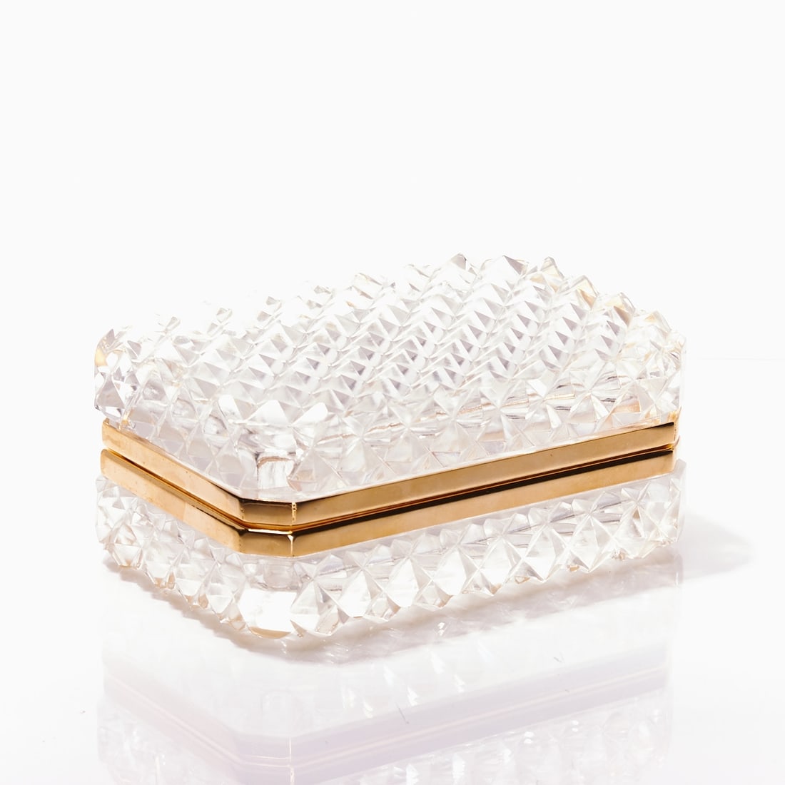 Octagonal lidded box - Art Deco. France, circa 1935-1940.: Octagonal lidded box - Art Deco France, circa 1935-1940. Thick-walled, colorless glass, blown into mold. Surface with small, raised pyramids. Edges ground. Gilded brass mounting with hinge. H. 6 cm,