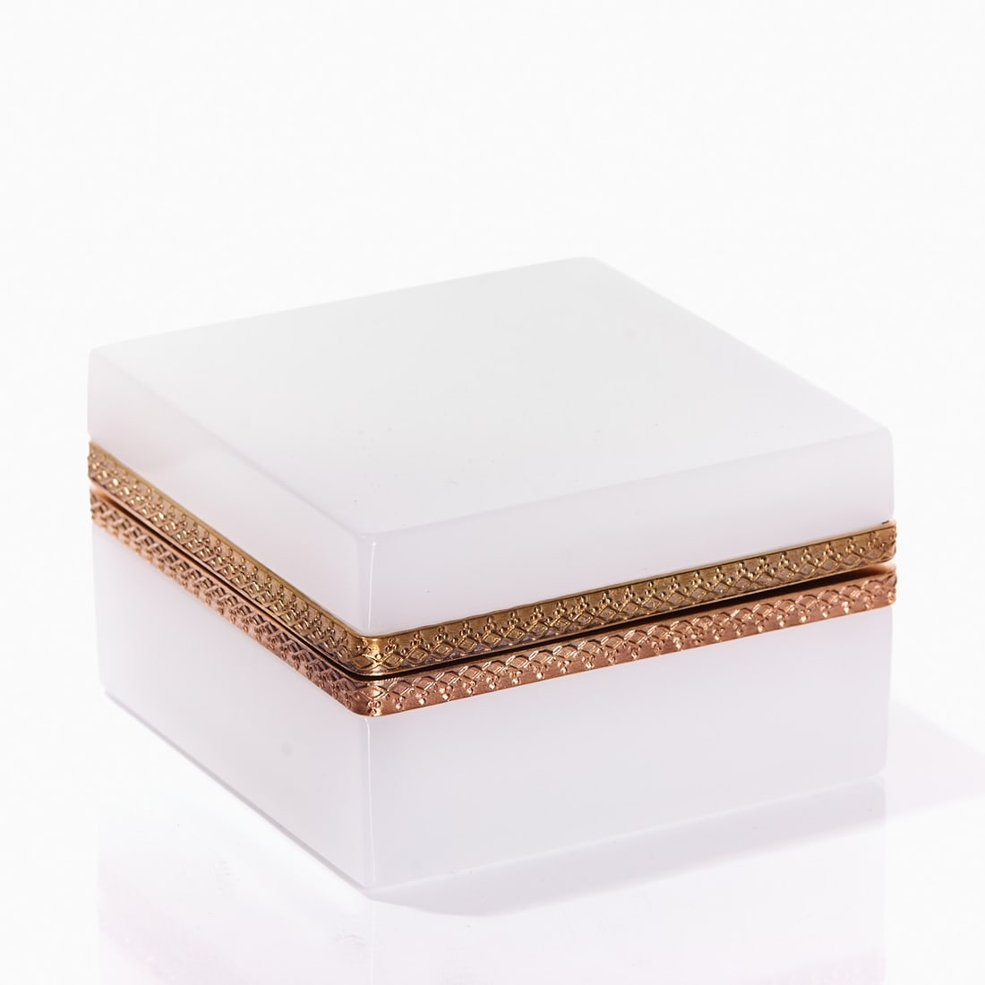 Square lidded box - Art D?©co. France, circa 1935-1940.: Square lidded box - Art Déco France, circa 1935-1940. Thick-walled, white opal glass, slightly translucent, cut and polished. Gilt brass mounting with hinge. Embossed mounting. H. 6 cm, 9.5 x 9