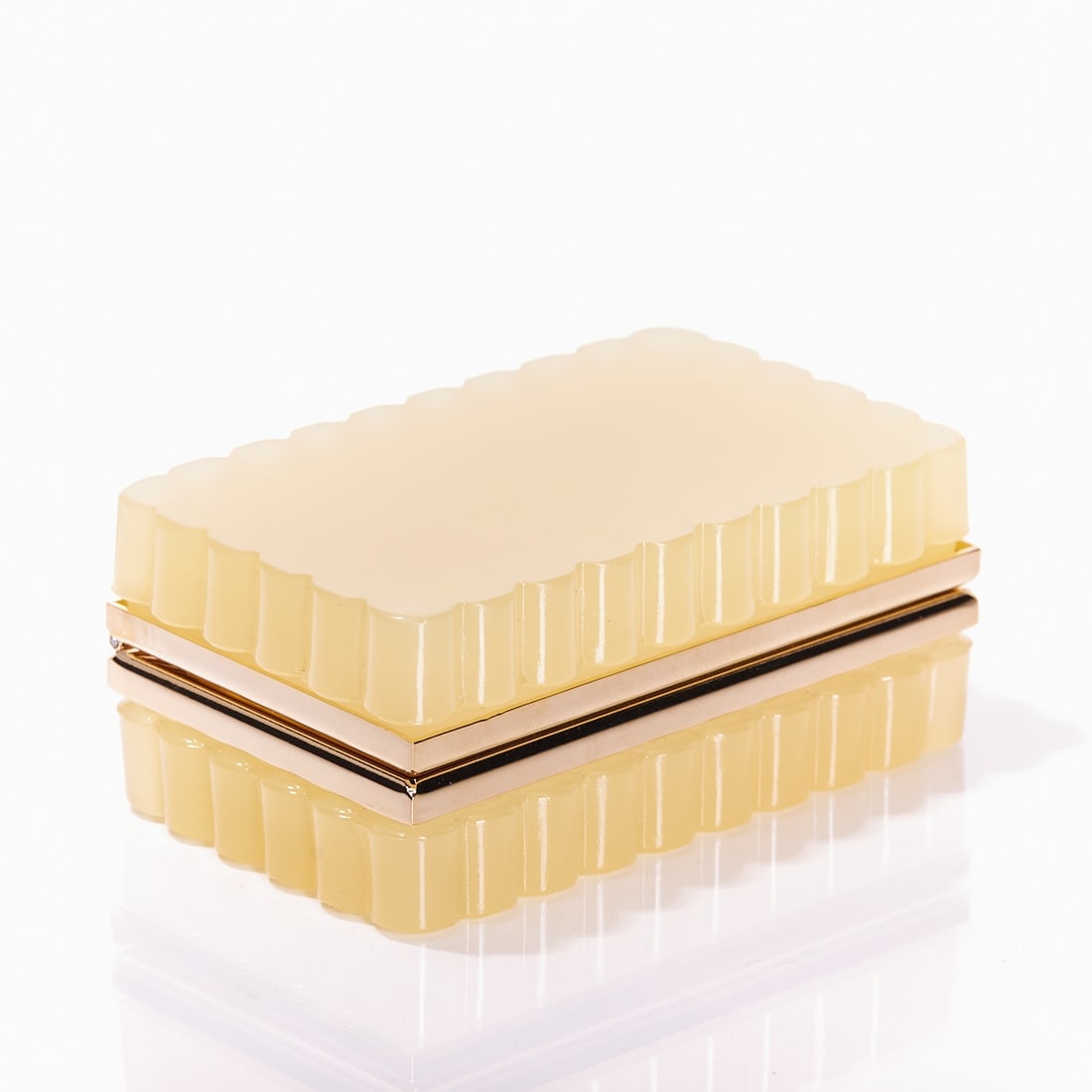 Rectangular lidded box with wavy edge - Art D?©co. France, circa 1935-1940.: Rectangular lidded box with wavy edge - Art Déco France, circa 1935-1940. Uranium glass: Thick-walled, cream-colored glass (apple green), translucent, cut and polished. Gilded brass mounting wi