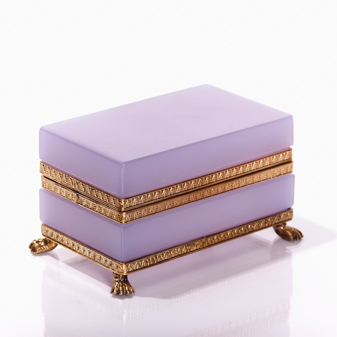Rectangular lidded box on mounting with lion's feet - Art Deco. France, circa 1935-1940.: Rectangular lidded box on mounting with lion's feet - Art Deco France, circa 1935-1940. Thick-walled, Alexandrite glass / rare earth oxides Neodymium (violet / green) - opal glass, slightly translucen