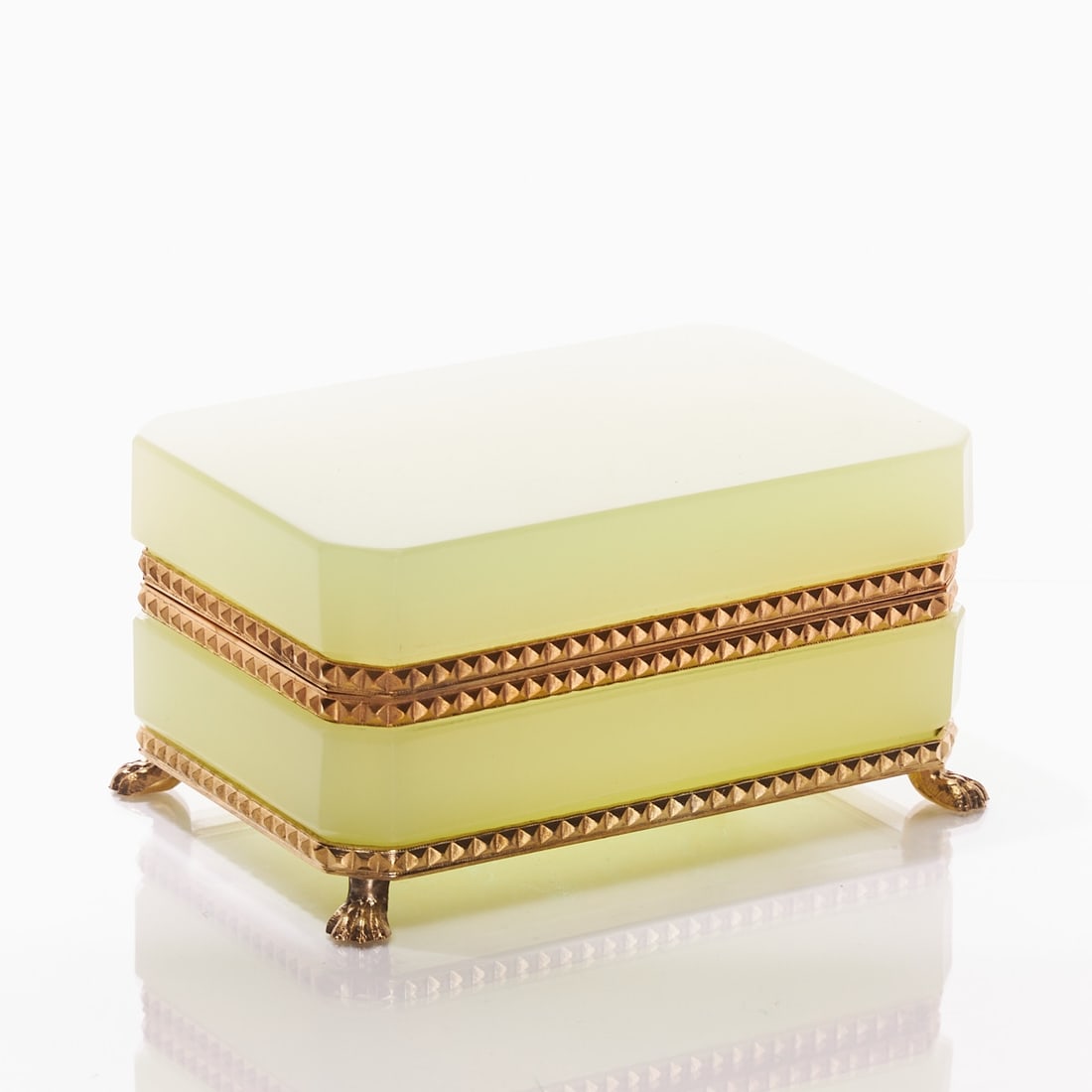 Octagonal covered box on mounting with lion's feet - Art Deco. France, circa 1935-1940.: Octagonal covered box on mounting with lion's feet - Art Deco France, circa 1935-1940. Uranium glass: Thick-walled, green opaline glass (apple green), slightly translucent, cut and polished. Edges cut