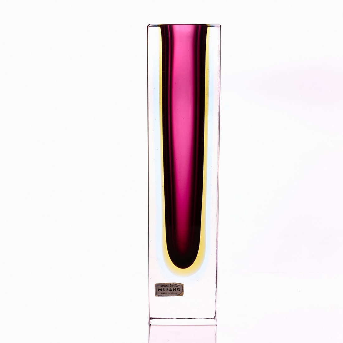 Vase - Sommerso. Murano.: Vase - Sommerso Murano. Colorless glass with violet, yellow, and blue underlay. Paper sticker (slightly rubbed): ARTISTIC CRISTAL MURANO MADE IN ITALY. H. 25.5 cm, base: 6.2 x 6.2 cm.