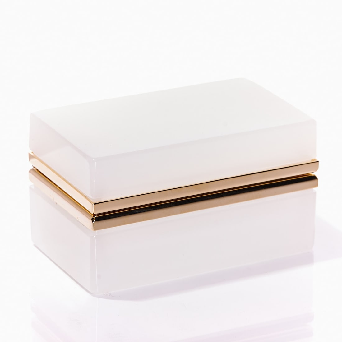 Rectangular lidded box - Art Deco. France, circa 1935-1940.: Rectangular lidded box - Art Deco France, circa 1935-1940. Thick-walled, white opal glass, slightly translucent, cut and polished. Gilded brass mounting with hinge. H. 6 cm, 6.5 x 11 cm.