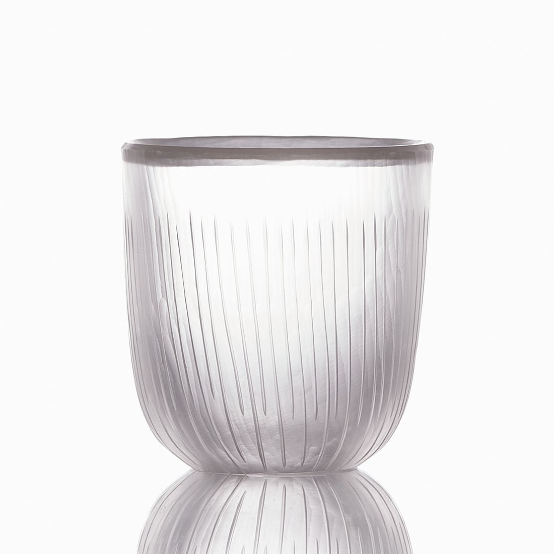 Small vase. Probably Markku Solo for Iittala Glassworks Finland, 1950s.: Small vase Probably Markku Solo for Iittala Glassworks Finland, 1950s. Thick-walled, colorless glass. Upper edge beveled. Outer wall cut with slightly twisted, fine, lines of varying length. Ground po