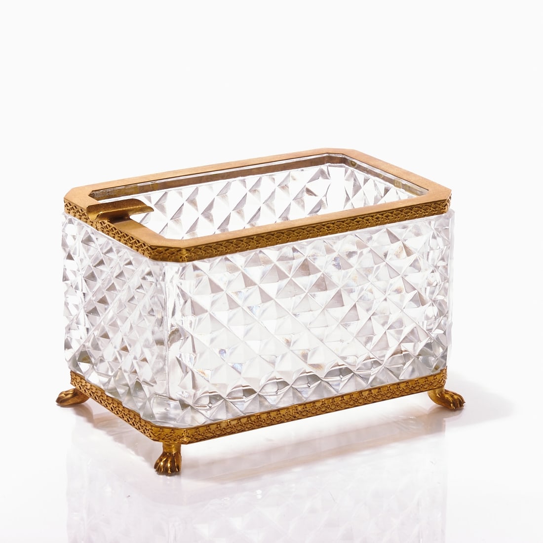 Tall octagonal ashtray - Art Deco. France, circa 1935-1940.: Tall octagonal ashtray - Art Deco France, circa 1935-1940. Thick-walled, colorless glass, blown into shape. Surface with small, raised pyramids. Edges ground. Gilt brass mounting with relief and an ov