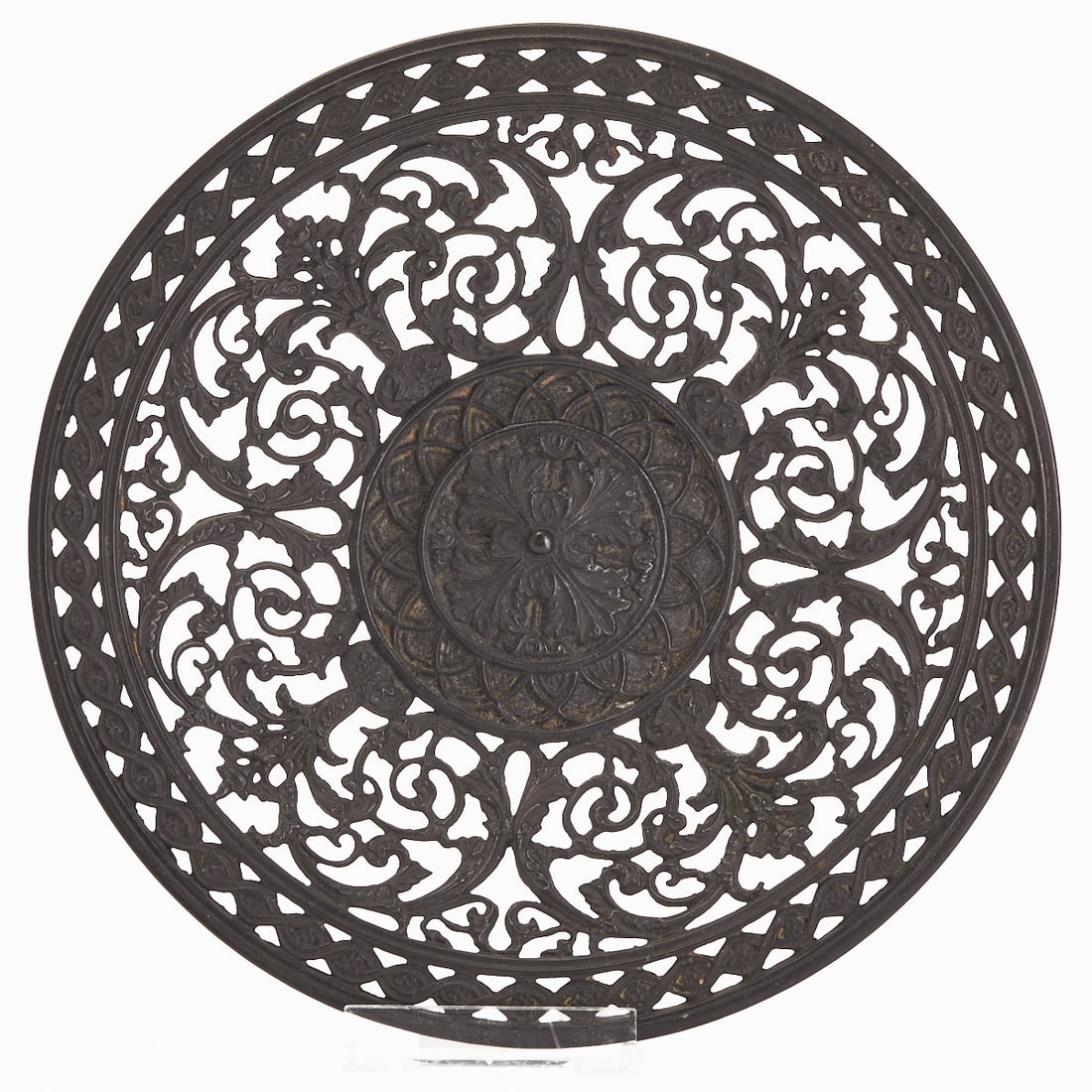 Buderus wall plate: Buderus - Wall plate Germany, 20th century. Pewter, richly pierced, with symmetrical floral tendrils and a central rosette. On the reverse with Buderus mark and hanging device. D. 21.5 cm.