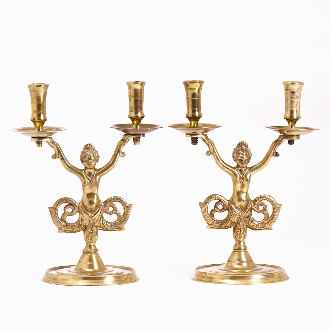 Pair of two-flame candelabra with sirens: Pair of two-flame candelabra with sirens France, 19th century. Bronze. Each two-flame candelabra with a figural representation of a siren holding up the curved candelabra arms. The arms with acanthus