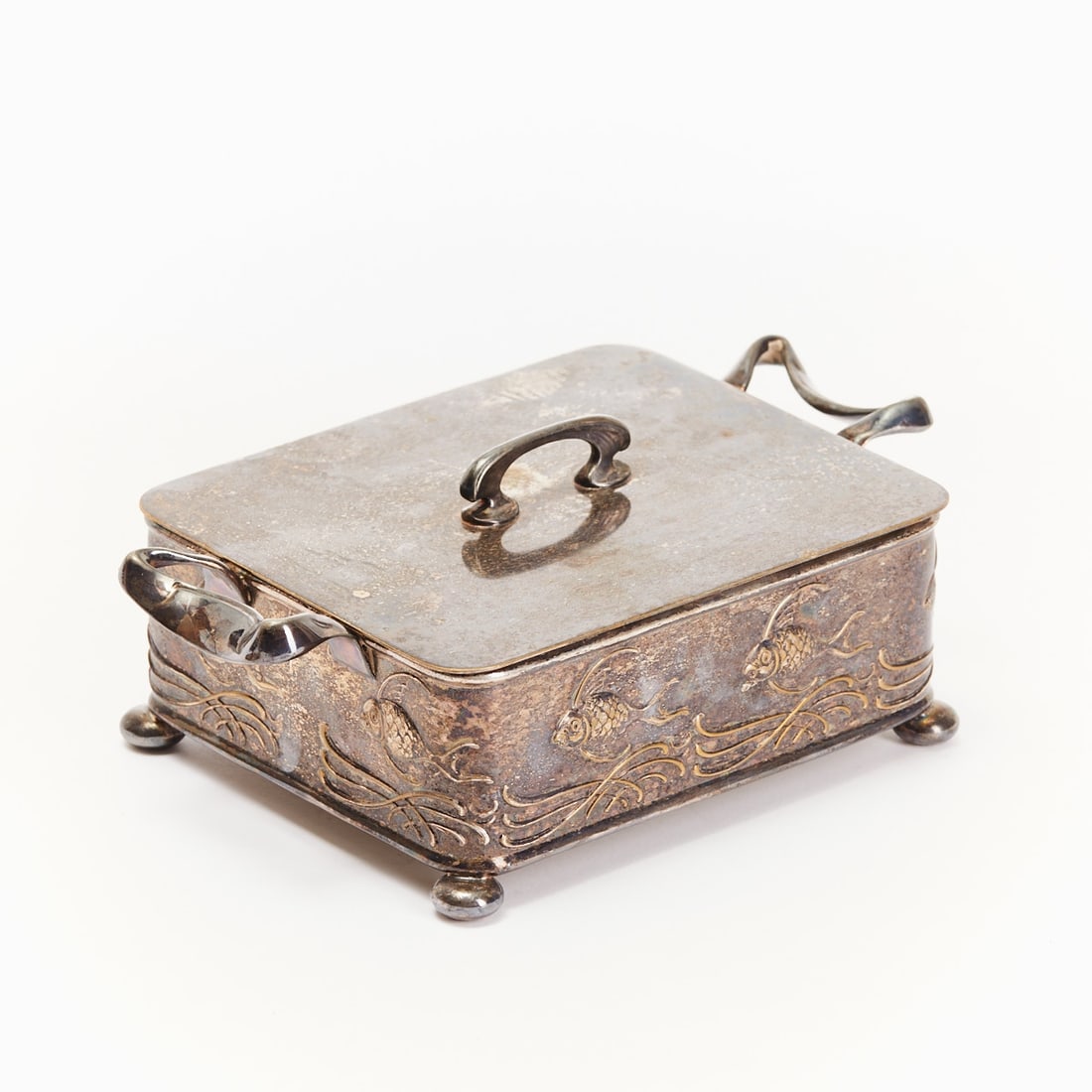Art Nouveau butter dish: Art Nouveau lidded box with glass insert Germany/Austria, circa 1900. Silver-plated metal, colorless glass insert. 19 × 12 × 7 cm. Rectangular body on four ball feet, curved side handles,