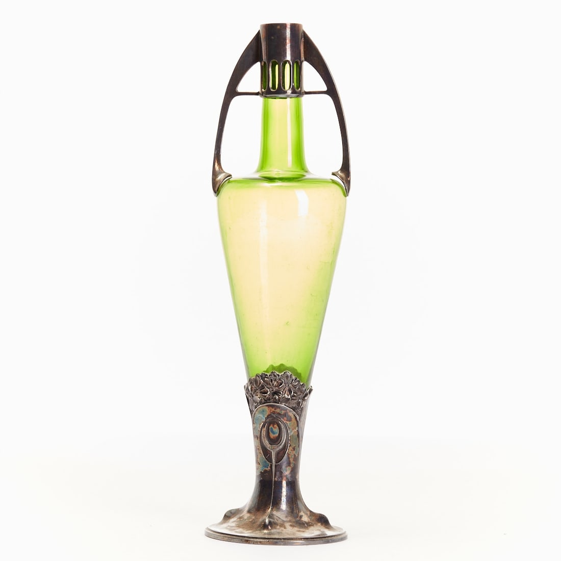 Vase. Orivit A.G., Cologne circa 1900.: Vase Orivit A.G., Cologne circa 1900. Metal, silver-plated, green glass. Elongated conical glass body with straight shoulder and slender cylindrical neck. Mounting with two arched handles ending on th