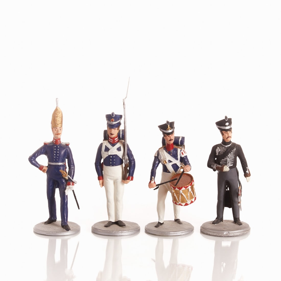 Collection of Tin Figures: Collection of Tin Figures 20th century. 4 pieces. Tin, polychrome and gold painted. H. 11 cm - 15 cm. Base diameter approx. 4.7 cm. Good condition. Provenance: From the possession of a North German