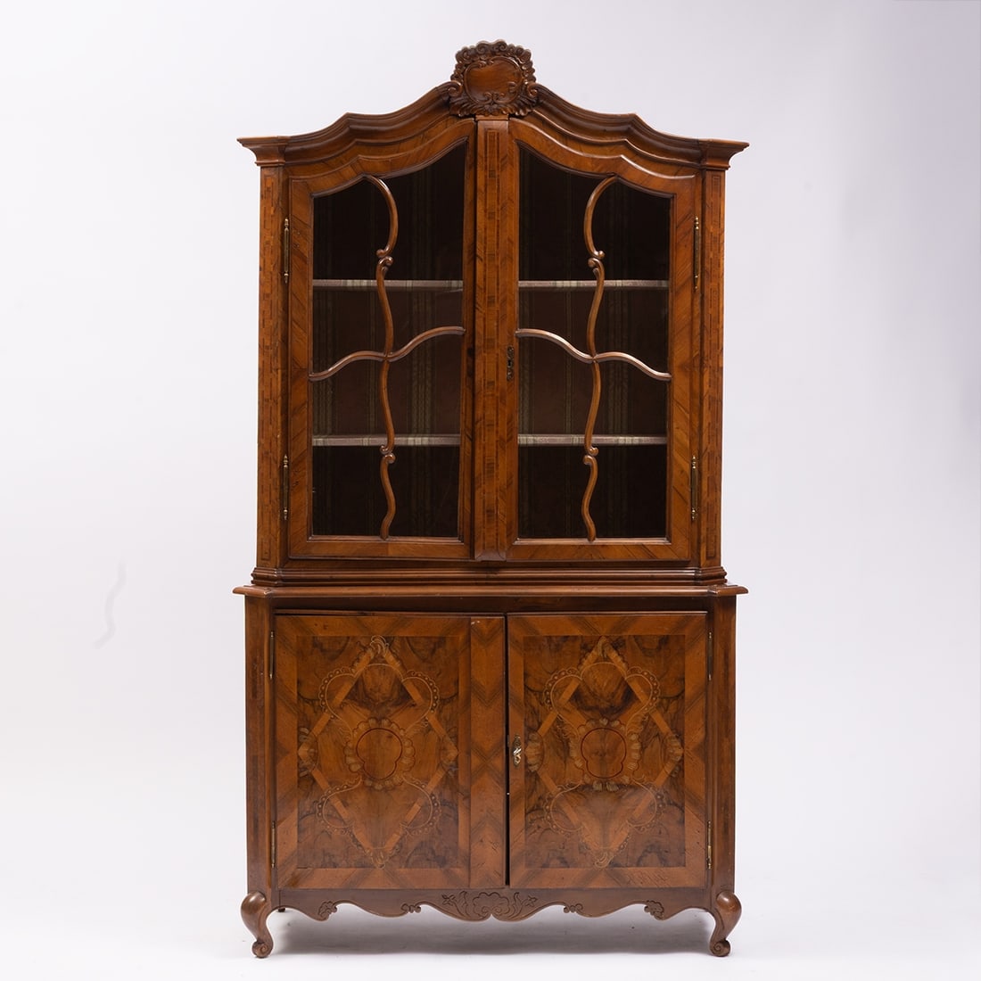 Baroque Display Cabinet with Top: Baroque Display Cabinet with Top Germany, 18th century. Walnut. Plum. Fruitwood. 205 x 118 x 50 cm. On four splayed legs with a curved frame. Rectangular body with two doors, richly decorated with
