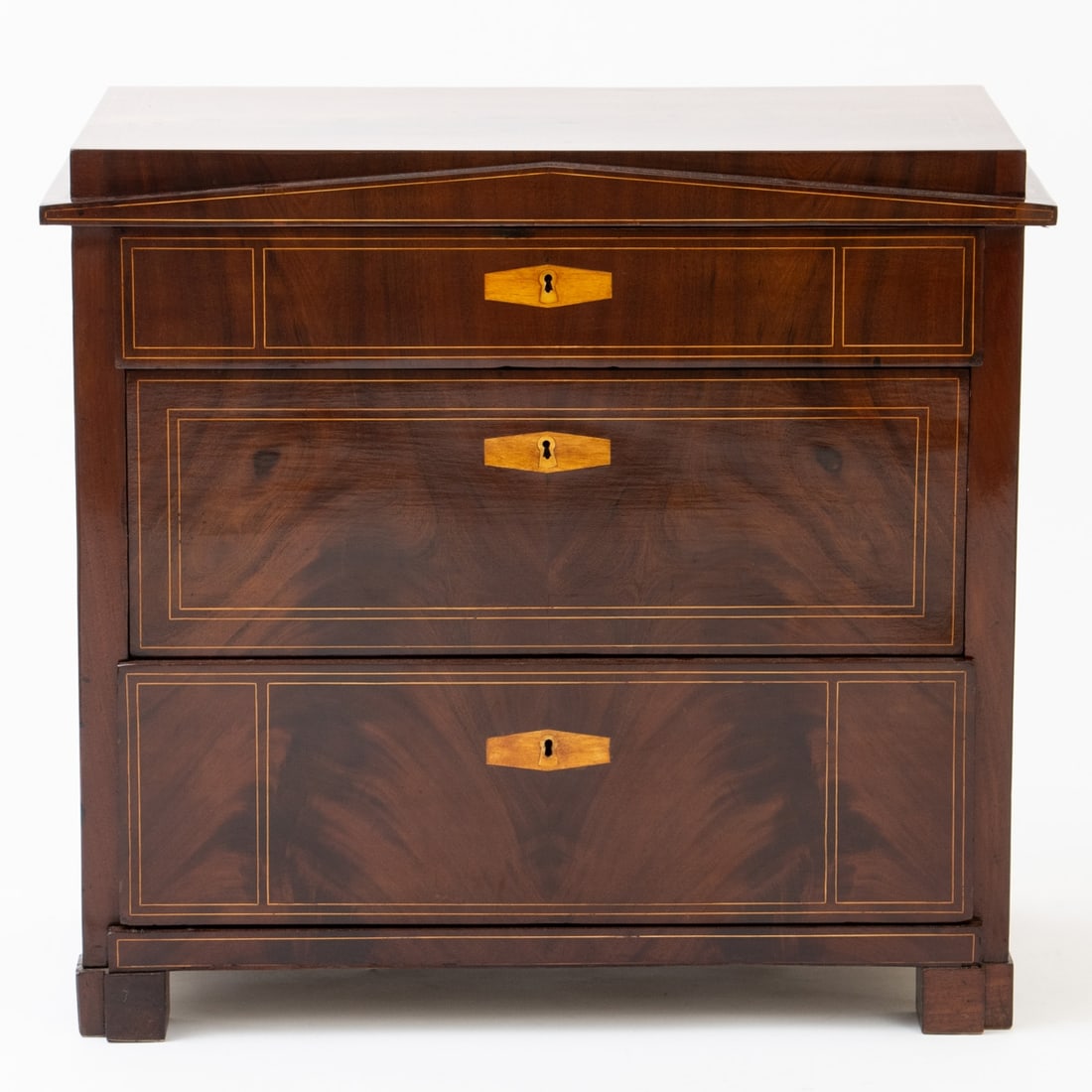 Biedermeier Chest of Drawers: Biedermeier Chest of Drawers Northern Germany/Berlin, circa 1820. Mahogany. Fruitwood. 84 x 89.5 x 48 cm. On four block feet. Rectangular body with three drawers. Topped with a cover plate with a