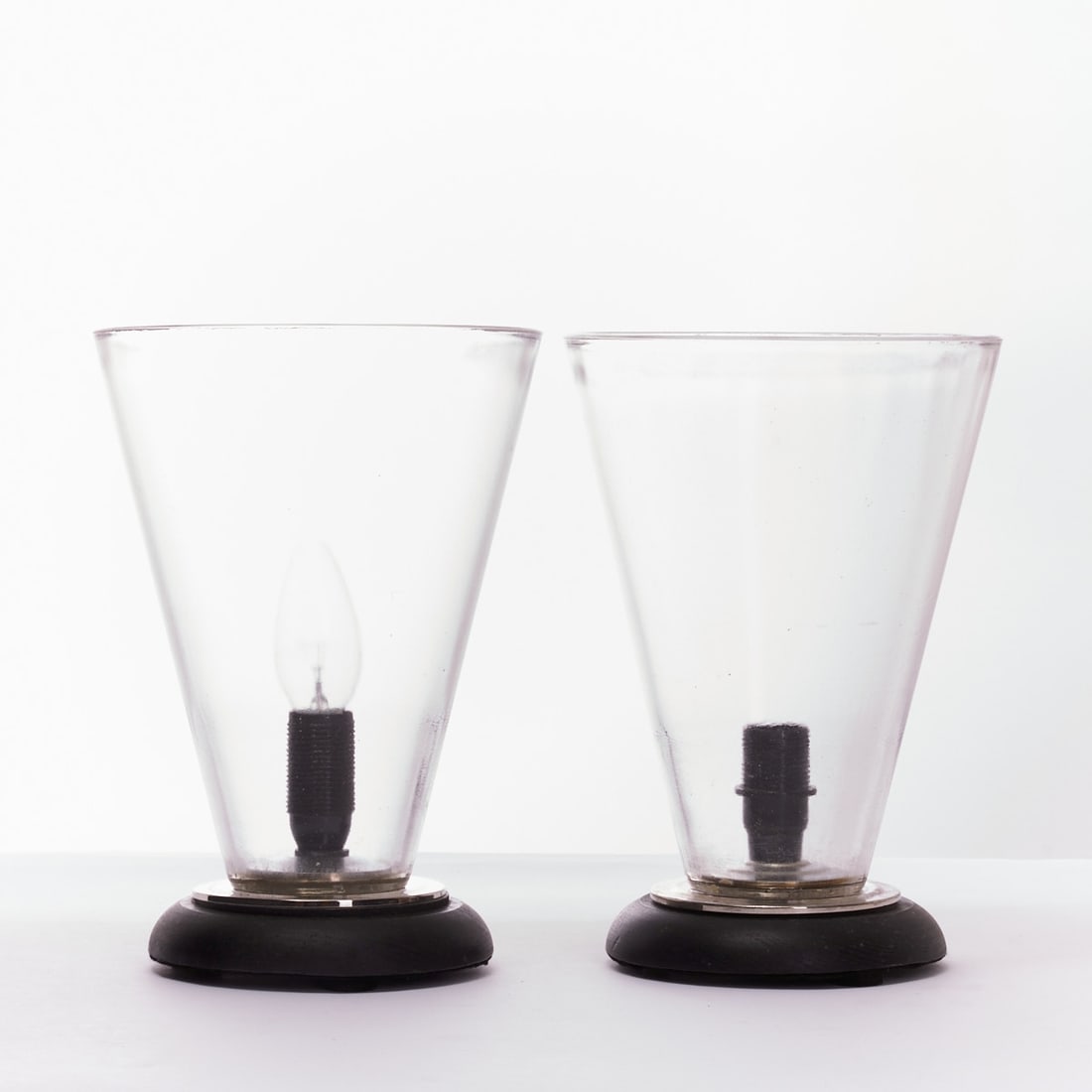 Pair of Table Candlesticks, so-called Wind Lights: Pair of table candlesticks, so-called wind lights Glass. Wood. H. 25.5 cm. D. 18 cm.