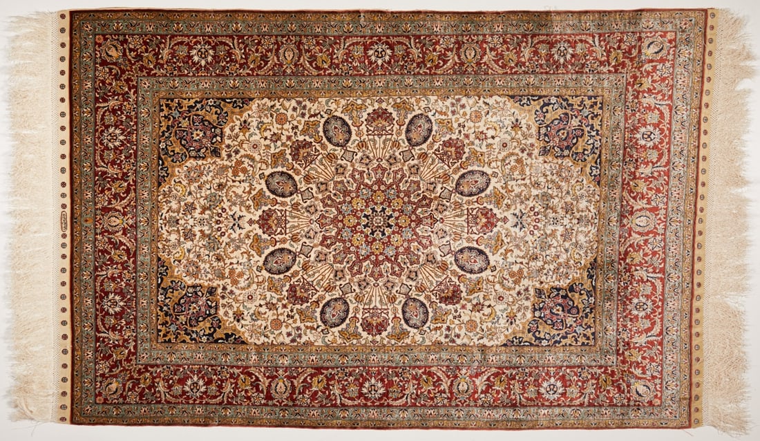 Hereke ?–zipek: Hereke Özipek Turkey, 20th century. Silk on silk, approx. 120 x 80 cm, hand-knotted, signature. Ivory-colored central field, multi-layered central medallion, bright red border. A small cut