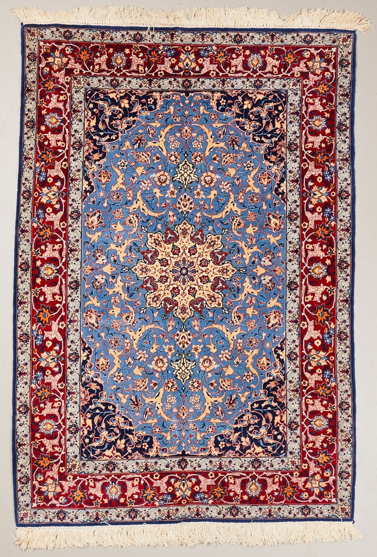 Isfahan Carpet: Isfahan Carpet Persia, 20th century. Wool on cotton, approx. 170 × 107 cm. Finely hand-knotted carpet with approx. 800,000-1 million knots. Light blue central field with a large floral central