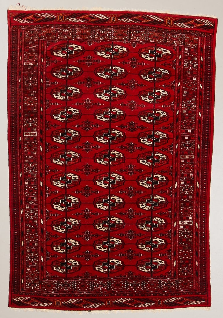 Bukhara Carpet: Bukhara Carpet Central Asia, 20th century. Wool on wool, approx. 176 × 117 cm. Finely hand-knotted carpet with a vibrant red ground and regularly arranged octagonal Tekke Guls in shades of