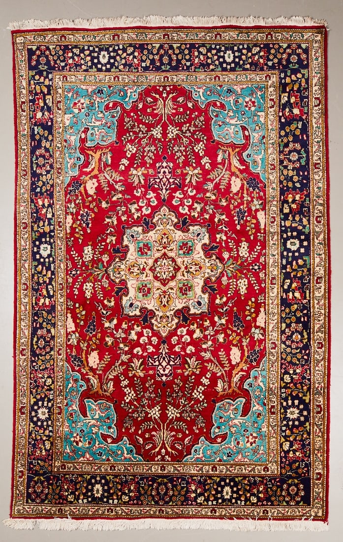 Tabriz Carpet: Tabriz Carpet, Persia/Orient, 20th century. Wool on cotton, approx. 310 x 195 cm. Hand-knotted carpet with a strong red central field and a central, florally elaborated medallion in shades of cream,
