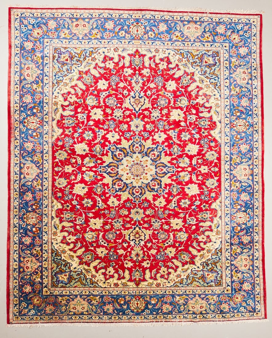 Kashan Carpet: Kashan Carpet, Persia, 20th century. Wool on cotton, approx. 400 x 300 cm. Hand-knotted carpet with a strong red central field and a central floral medallion in shades of cream, blue, green, and red.