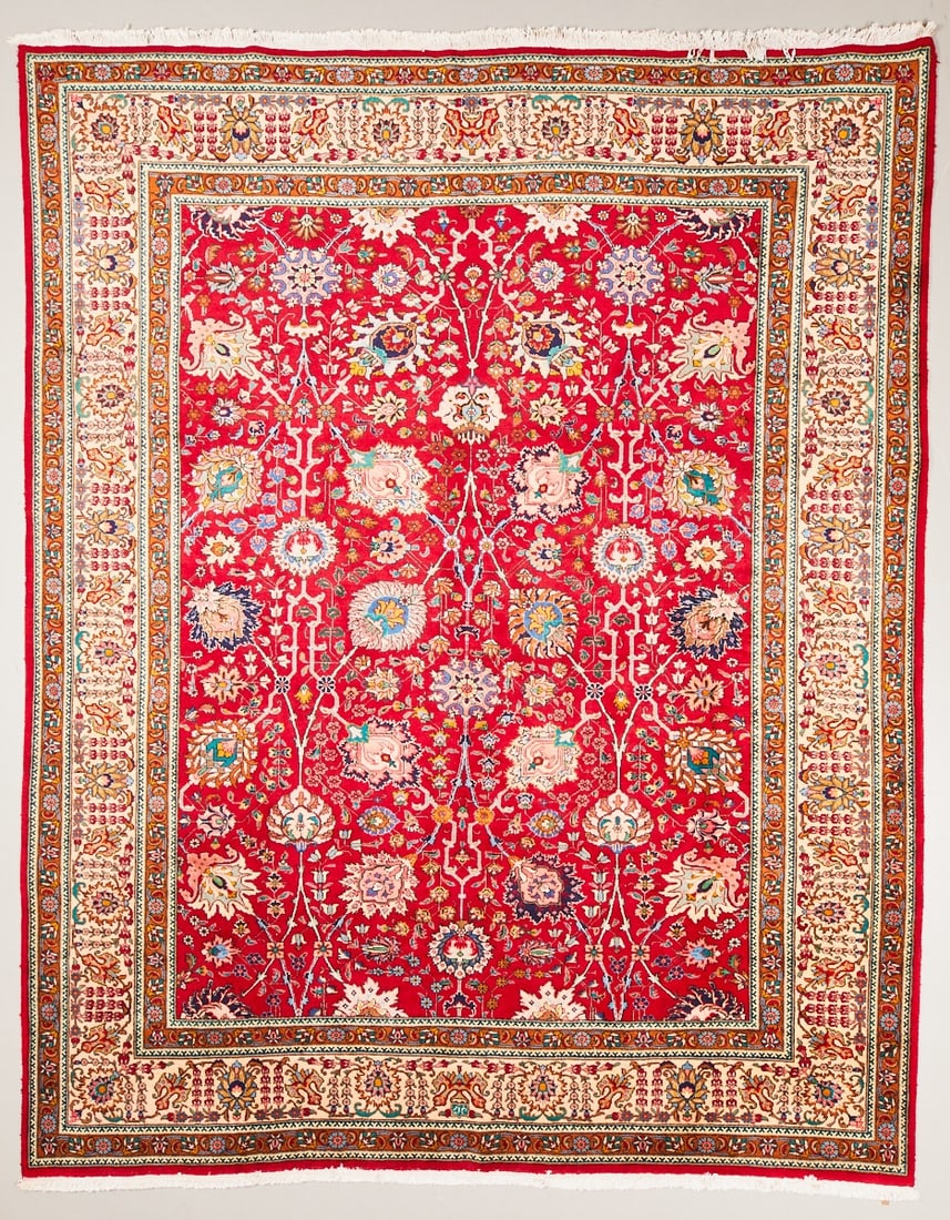 Tabriz Carpet: Tabriz CarpetPersia, 20th century. Wool on cotton, approx. 373 × 300 cm. Signed. Hand-knotted carpet with a red central field and dense floral decor of stylized flowers, tendrils, and palmettes