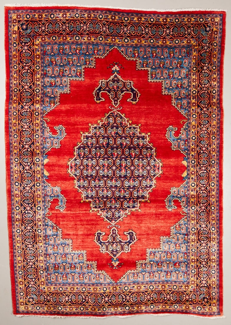 Persian Carpet: Persian Carpet Persia/Orient, 20th century. Wool on cotton, approx. 315 x 221 cm. Hand-knotted carpet with a red central field and several large, geometric medallions in dark blue, light blue, cream,