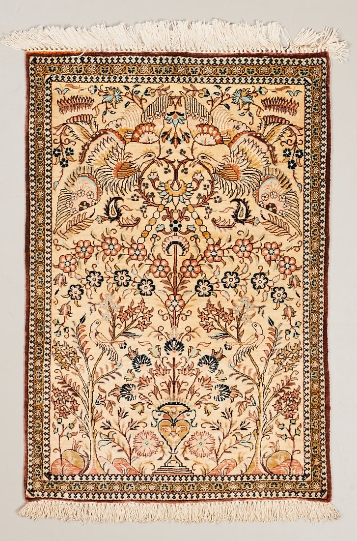 Silk Carpet: Silk pictorial carpet Persia, 20th century. Silk, approx. 85 × 57 cm. Finely knotted pictorial carpet with a light ground and a central tree of life, surrounded by numerous birds, flowers, and