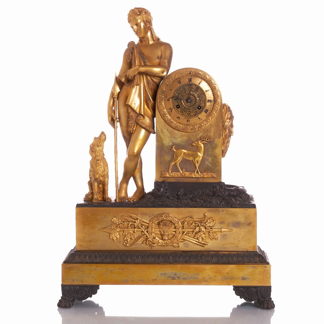 Rare Empire Pendulum Clock with Diana and Hunting Dog: Rare Empire Pendulum Clock with Diana and Hunting Dog France, circa 1810. Bronze/gilt. H. 59 cm. Striking on bell. Spring suspension. Roman numerals. Signed on the plate: P.D. 4511. Movement and