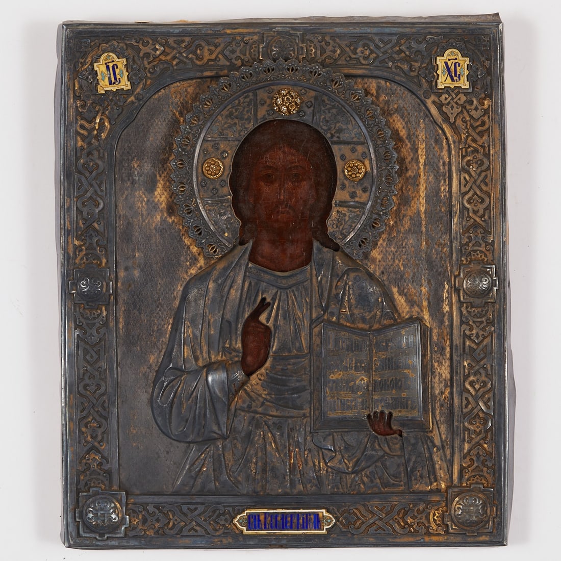 Icon: Icon Russia, 1878. - Christ Pantocrator - Tempera/wood, silver oklad. 34 x 28.5 cm. Christ as a half-figure with a blessing right hand and an open Gospel. Richly ornamented, relief oklad with floral d