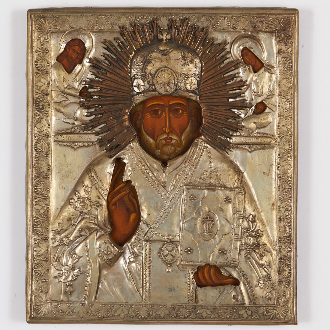 Icon: Icon Russia, probably late 19th century. - "Saint Nicholas of Myra" - Tempera/wood, with silver-plated oklad. 30 x 26 cm. The saint as a half-figure in episcopal vestments with mitre and