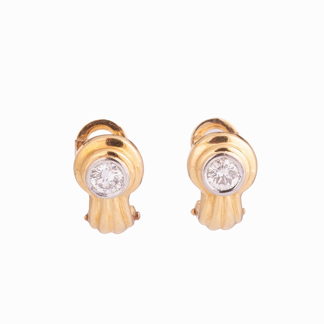Pair of Brilliant Solitaire Ear Clips as Hoops: Pair of Brilliant Solitaire Ear Clips as Hoops 750/- yellow gold and white gold, unmarked. Weight: 6.7 g. 2 solitaire brilliants totaling approx. 1 ct (tw/p). Length 1.5 cm. Width 1 cm. Clip