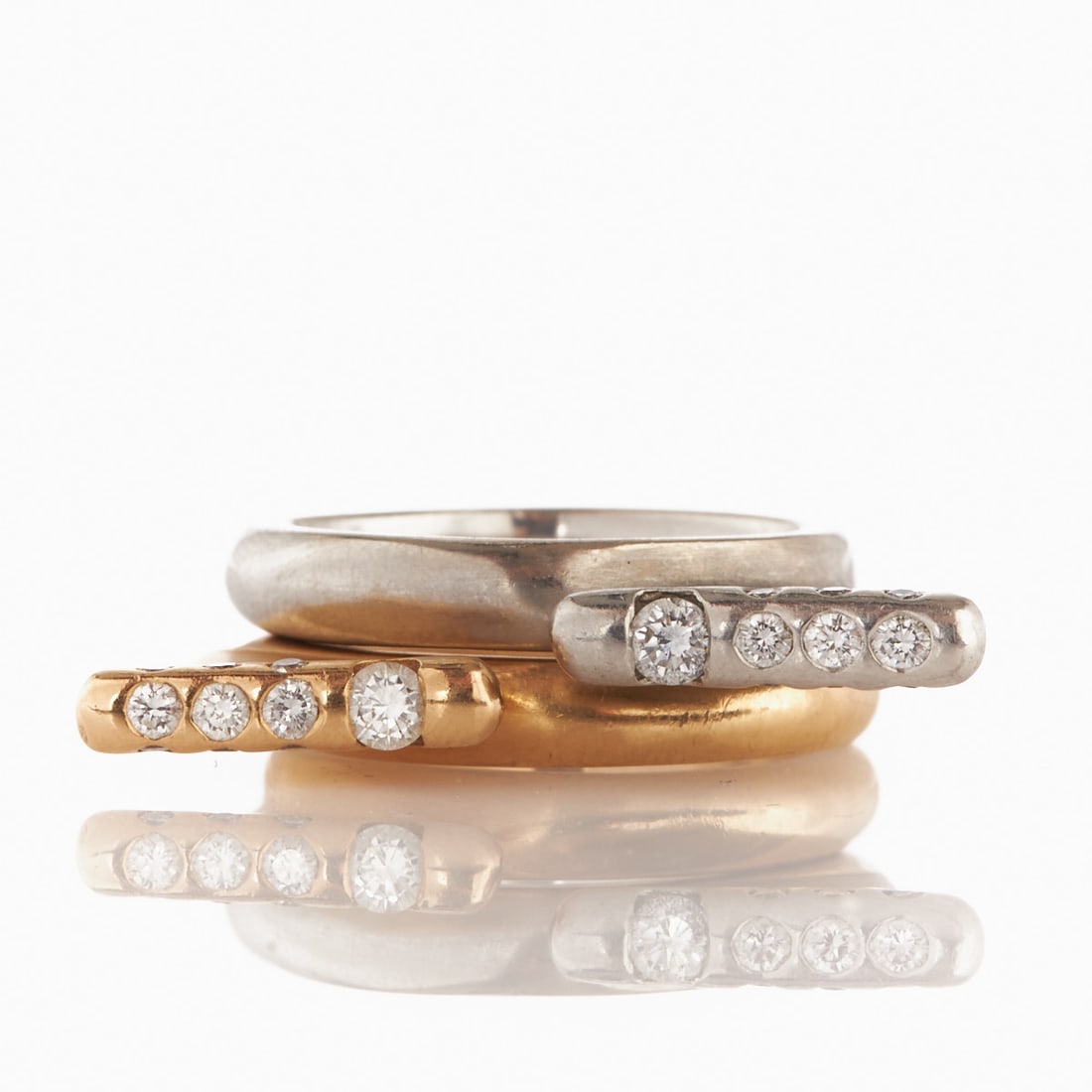 Pair of Brilliant Rings - Stacking Rings: Designer Jewellery: Pair of Brilliant Rings - Stacking Rings Handmade. 750/- yellow gold, hallmarked. Weight: 7.4 g. 950/- platinum, hallmarked. Weight: 11.7 g. Mark: GS, 750, 950. 2 brilliants totali