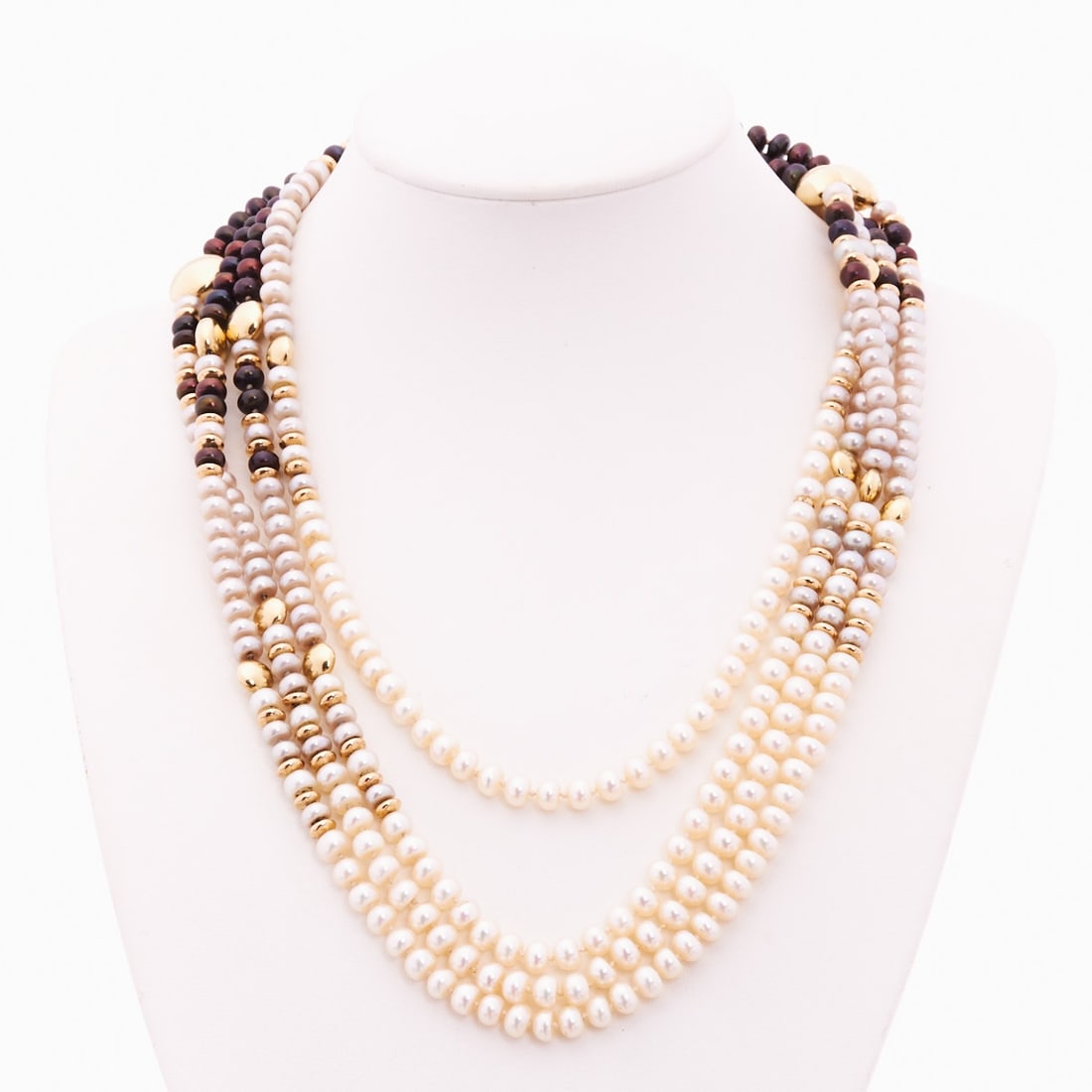 Long Endless Pearl Necklace with Yellow Gold Elements: Long Endless Pearl Necklace with Yellow Gold Elements 585/- yellow gold, unstamped, tested. Total weight: approx. 68 g. Various pearls (diam. 0.51 mm) in cream white and dark brown, alternating with