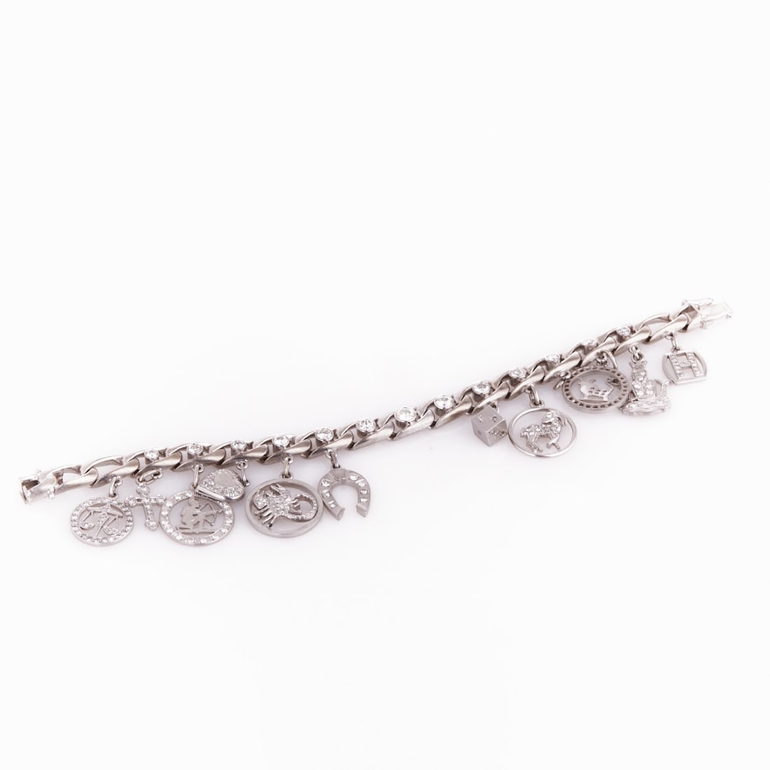 Charm Bracelet and Brilliants in White Gold: Charm Bracelet and Brilliants in White Gold 750/- and 585/- white gold, hallmarked. Total weight 68.1 g. Hallmark: Be in rhombus. 13 old-cut diamonds and various brilliant-cut and other diamonds total