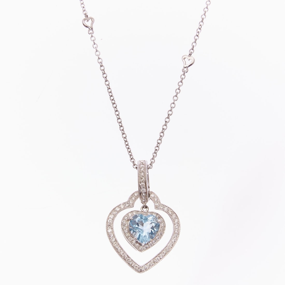 Aquamarine and Brilliant-Cut Diamond Heart Pendant with Chain: Aquamarine and brilliant-cut diamond heart pendant with chain 750/- white gold, stamped. Total weight: 9.9 g. 1 aquamarine in heart cut (approx. 0.8 x 0.8 cm), surrounded by various small