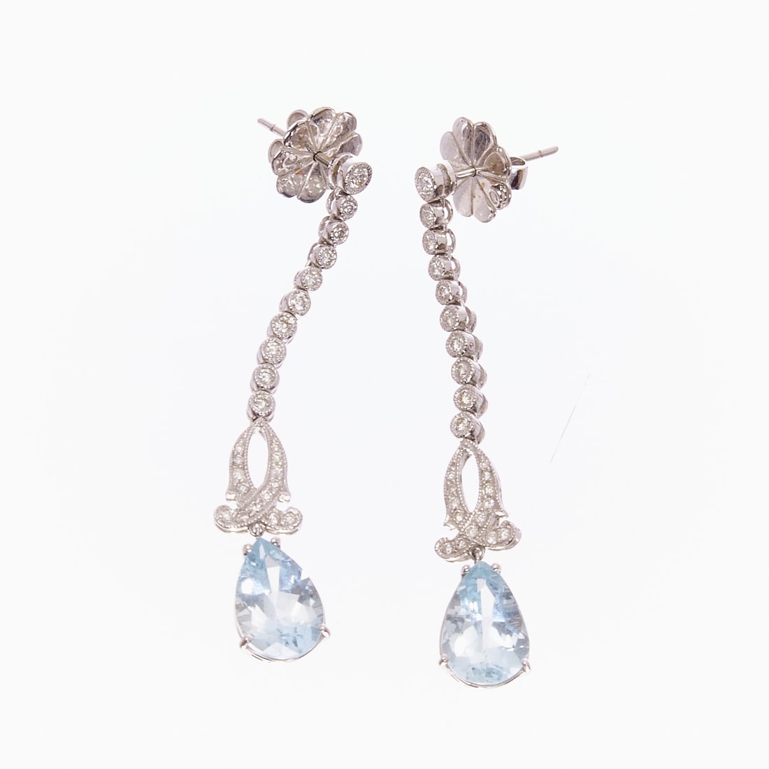 Pair of Aquamarine and Brilliant-Cut Diamond Drop Earrings: Pair of aquamarine and brilliant-cut diamond drop earrings 750/- white gold, stamped. Weight: 8.8 g. 2 aquamarines in drop cut (approx. 12 × 9 mm). Various brilliant-cut diamonds totaling