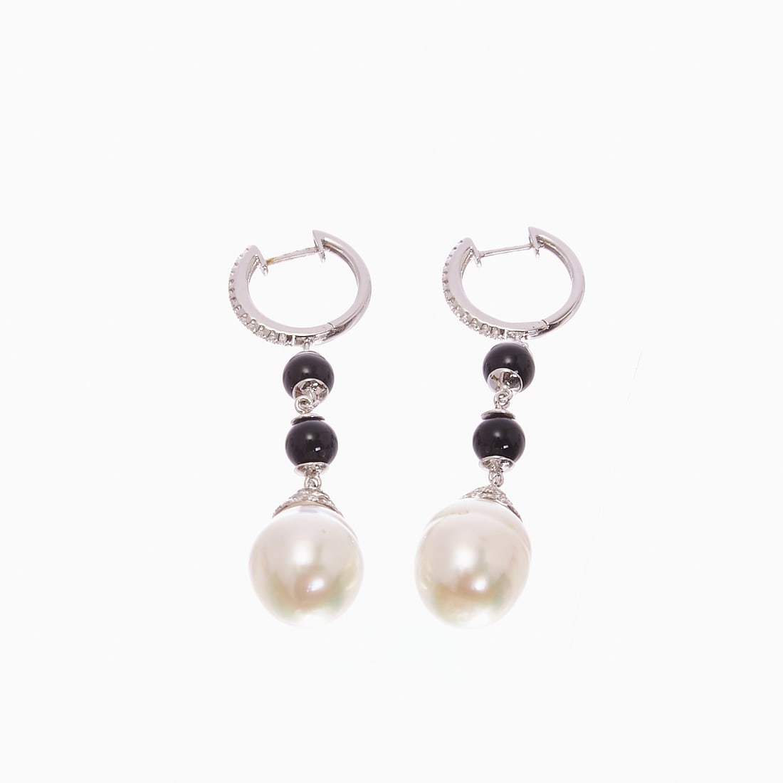 Pair of South Sea Pearl, Onyx, and Brilliant-Cut Diamond Drop Earrings: Pair of South Sea pearl, onyx, and brilliant-cut diamond drop earrings 750/- white gold, stamped. Total weight: 8.9 g. 2 baroque South Sea cultured pearls (approx. 10 x 13 mm). 4 onyx beads and
