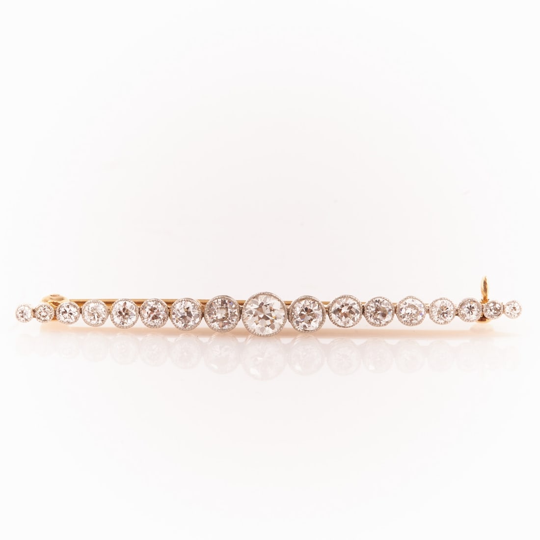 Diamond Stick Pin: Diamond stick pin Circa 1880. 750/- yellow gold and platinum, unstamped, tested. Total weight: 4.2 g. 17 old-cut diamonds totaling approx. 1.5 ct (tw-w/vsi-si). L. 5.8 cm. W. 0.5 cm. Pin with safety