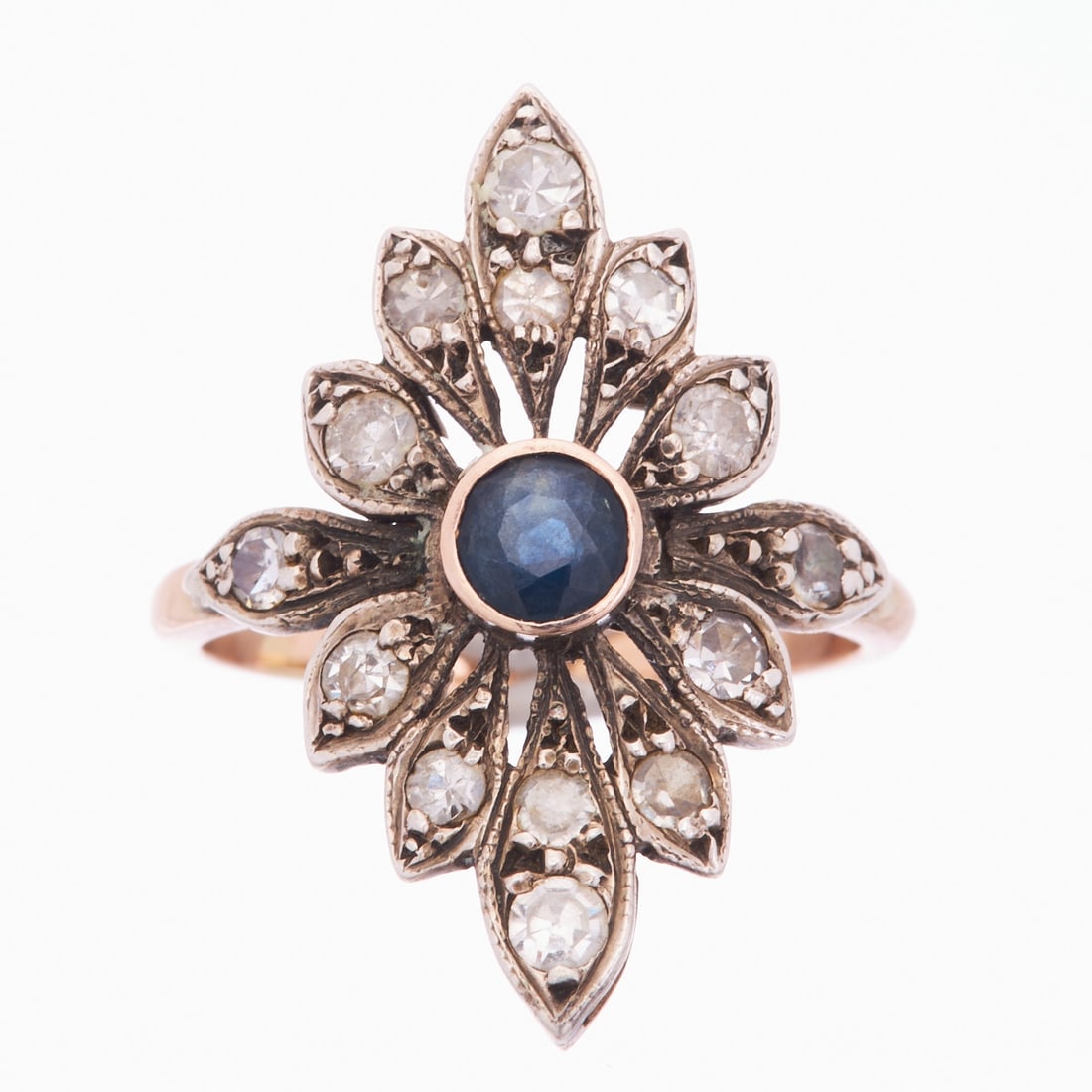 Art Deco Ring with Sapphire and Diamonds: Art Deco Ring with Sapphire and Diamonds Circa 1920. Probably 333/- rose gold and silver, unstamped. Weight: 3.91 g. Set with a round-cut sapphire of approx. 0.25 ct. 14 small rose-cut diamonds. Ring