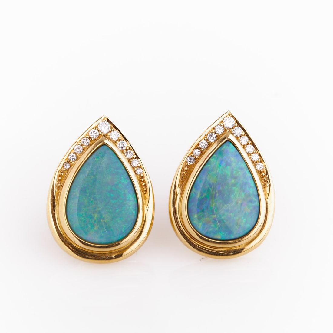 Pair of Ear Clips with Opal Drops: Pair of ear clips with opal drops Fa. Kröner, Hanover, 1990s 750/- yellow gold, stamped. Total weight 19.7 g. Hallmark: Kröner. 2 opals in drop shape (dimensions 1.6 x 1.2 cm). 22 brilliant-