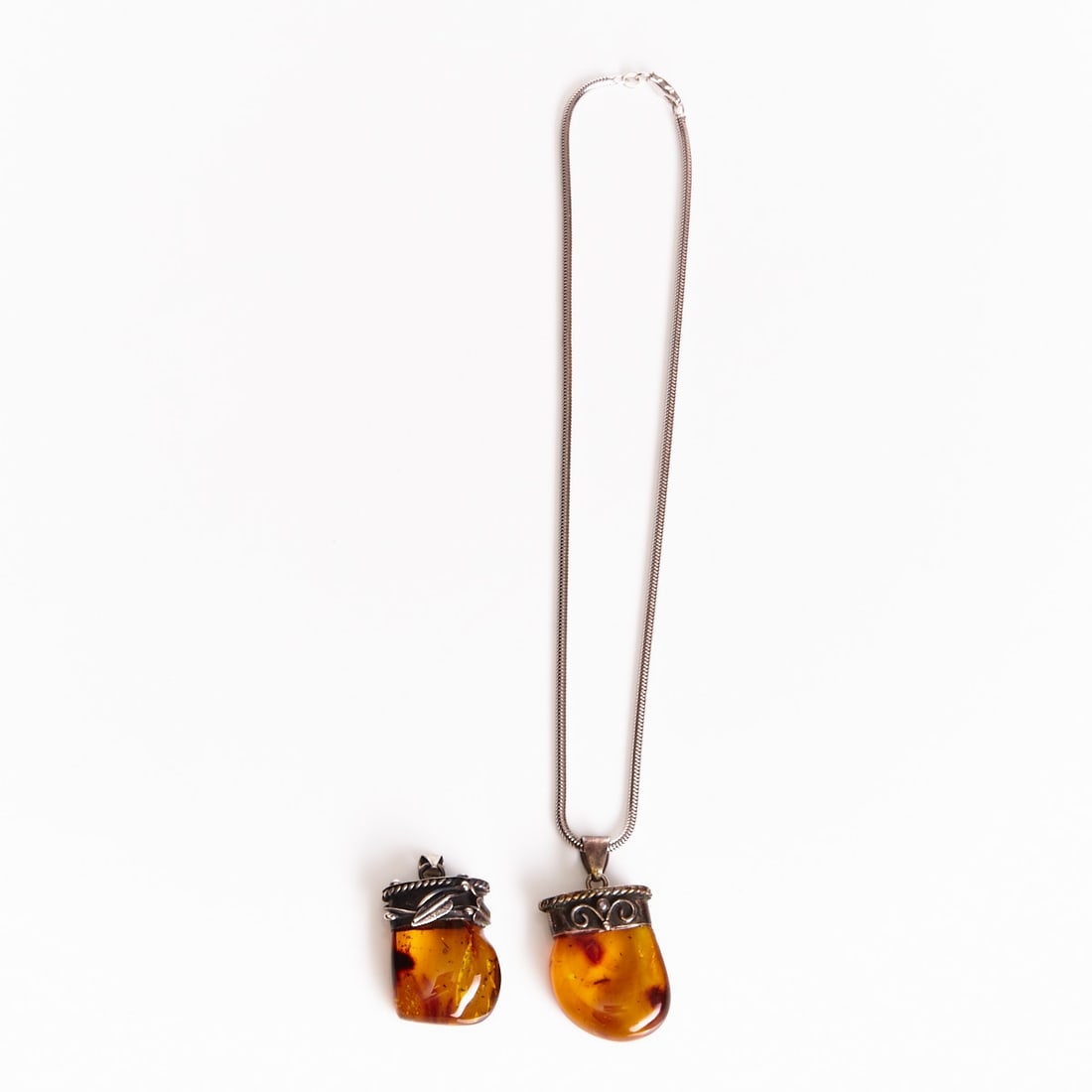 Two amber pendants with a silver chain (1 of 1)