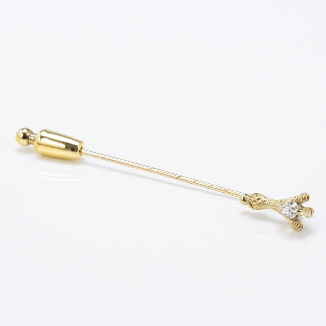 Tie Pin with Diamond: Tie Pin with Diamond 585/- yellow gold, stamped. Weight: 2.6 g (without stopper). 1 old-cut diamond approx. 0.15 ct. L. 7 cm. W. 0.9 cm. Pin with safety slider (not gold). Very good condition.