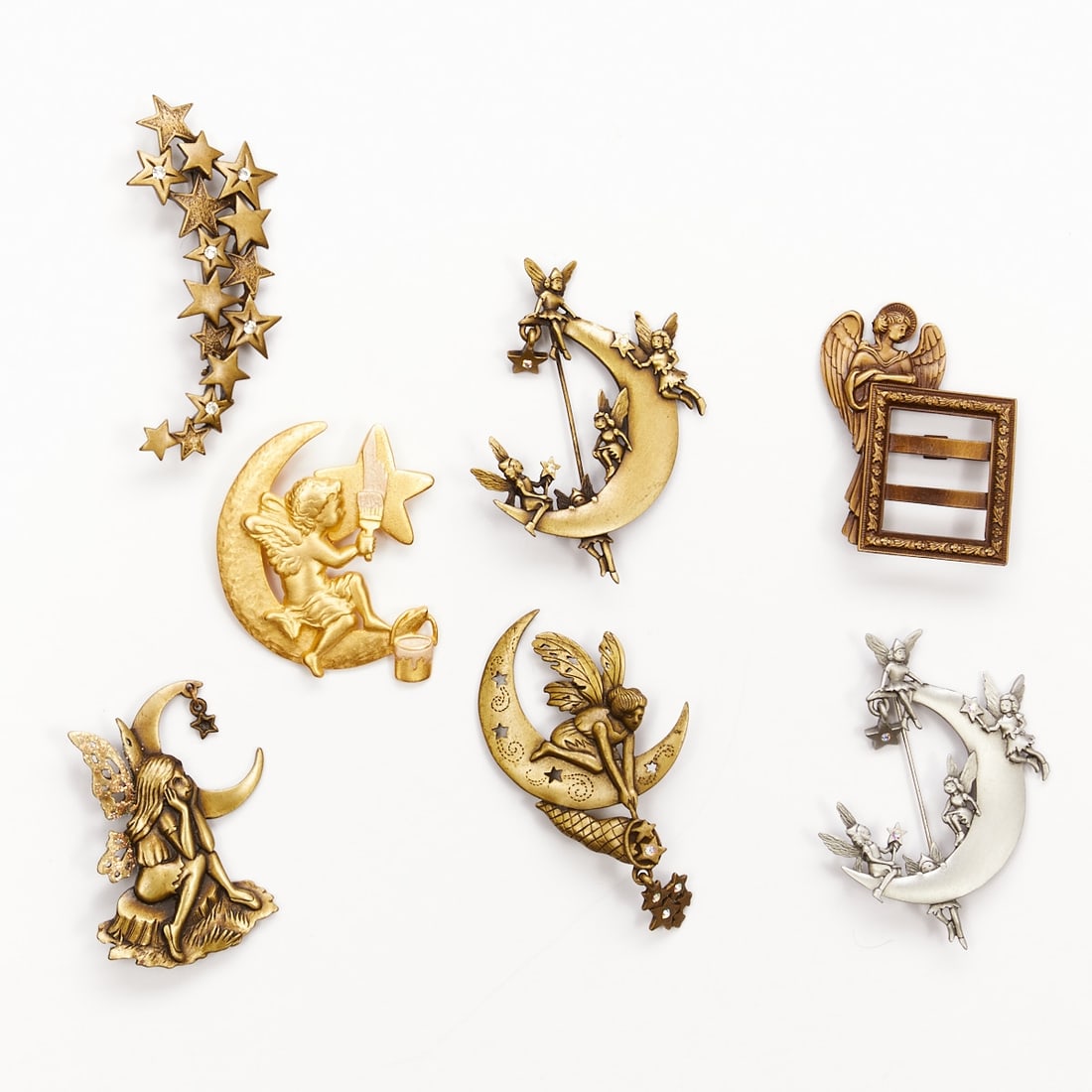 J.J. - Seven Beautiful Vintage Brooches with Star and Fairy Motifs (7 Pieces): J.J. - Seven beautiful vintage brooches with star and fairy motifs (7 pieces) The Jonette Jewelry Company (J. J.), USA, circa 1970 - 1990. Metal, gold-colored / silver-colored / bronze-colored. Total 