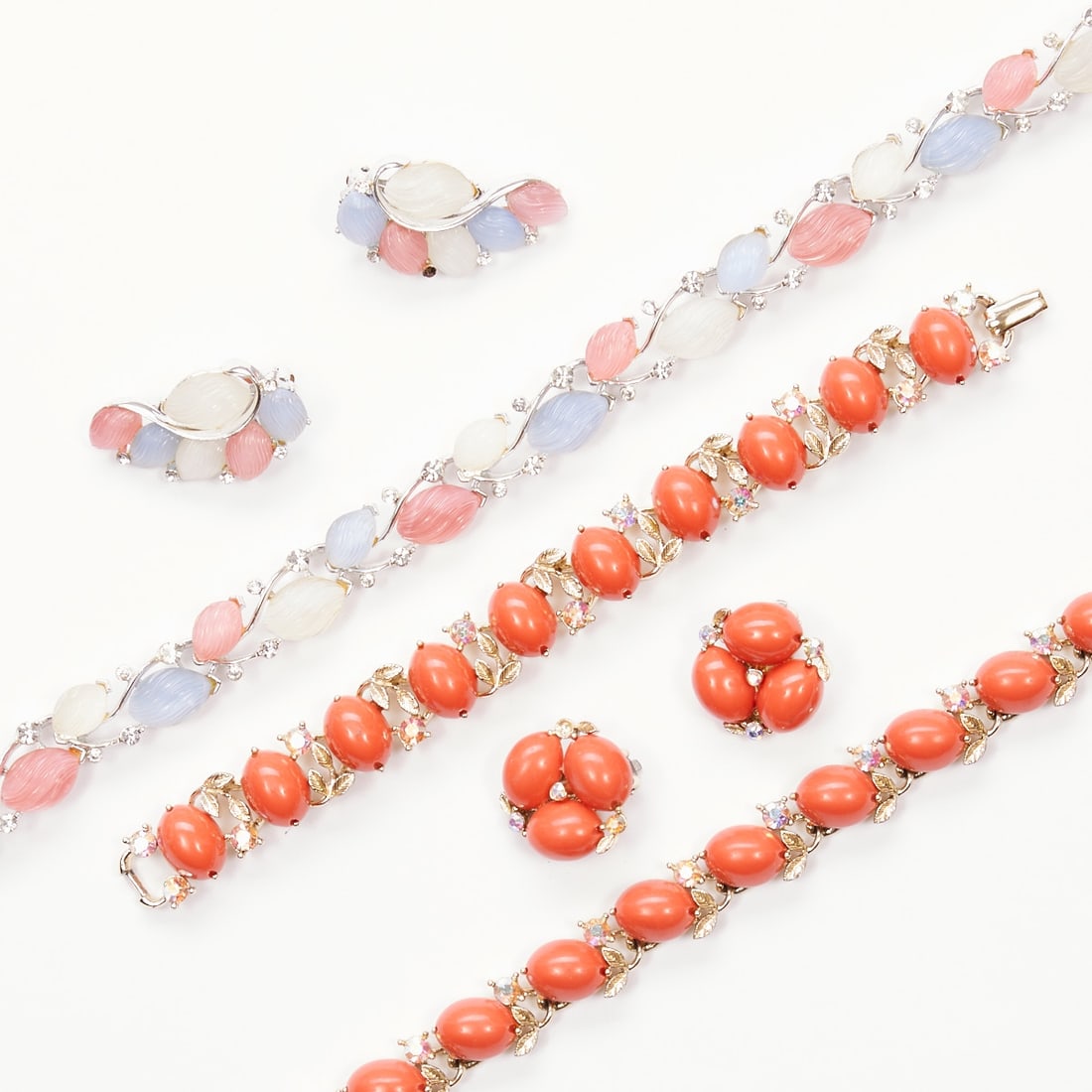 LISNER - Two Vintage Parures (5 pieces): LISNER - Two Vintage Parures (5 pieces) 2 necklaces, 1 bracelet and 2 pairs of ear clips. Lisner, New York, USA. Circa 1960-1990. Metal, white gold-coloured; rhinestones; glass beads; Lucite. Total we